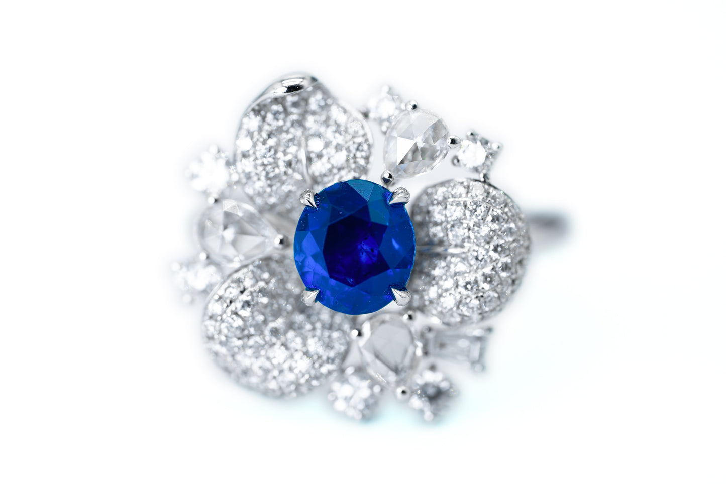 "Elegance in Bloom: Petal-Inspired Sapphire and Diamond Ring"