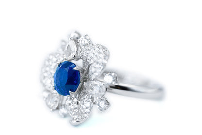 "Elegance in Bloom: Petal-Inspired Sapphire and Diamond Ring"