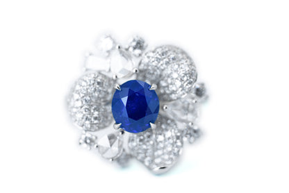 "Elegance in Bloom: Petal-Inspired Sapphire and Diamond Ring"