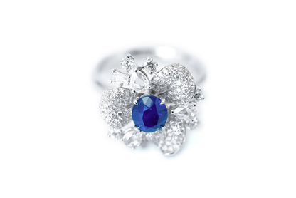 "Elegance in Bloom: Petal-Inspired Sapphire and Diamond Ring"